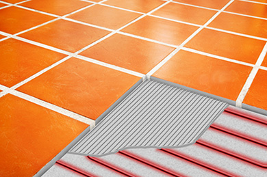 Ceramic tile floor showing illustration of cutaway of ComfortTile floor heating system.